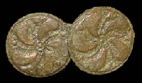 Cast copper alloy buttons with a floral or pinwheel pattern on the front.
